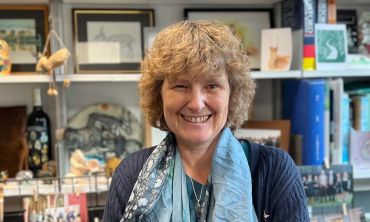 Photograph of Dame EJ Milner-Gulland in her office