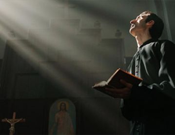 Priest in light